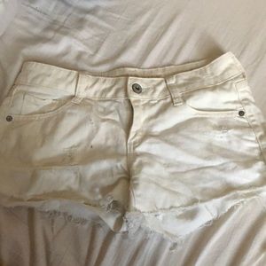 White ripped jean shorts